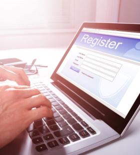 Laptop open to webpage to register